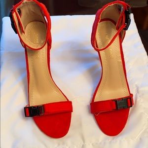 Strap heels , red orange color .